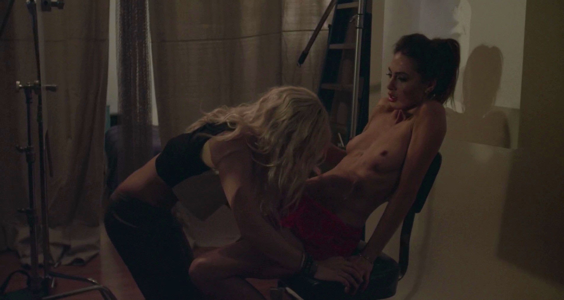 Roxy Olin and Briana Evigan kneels in front of her and the girls lesbian kiss